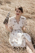 Robe midi fleurie ceinturée